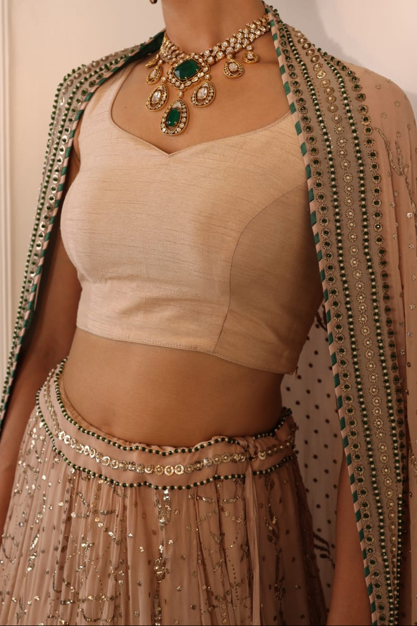 Champagne Mukaish Lehenga with Emerald Accents