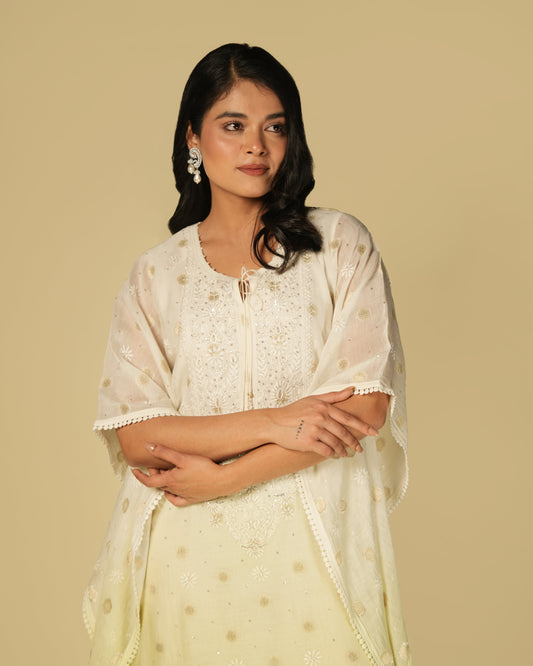 Woman wearing a shaded lime green chikankari mul chanderi kaftan.