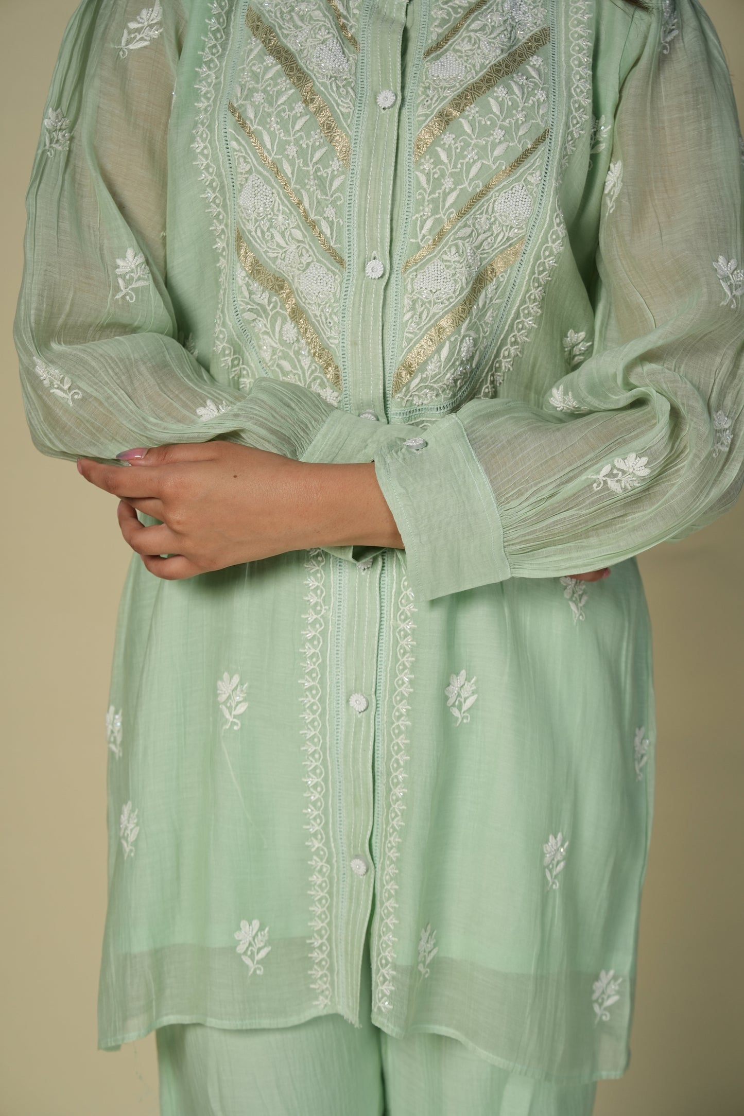 Close up of a green chikankari co-ord set.